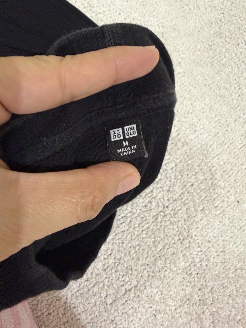 Uniqlo Black Ribbed Top M (Category: Shirts) located in Subic. Submitted by kittysclosetsale (Listing ID 1465093103, Image 3). Description: - Brand: Uniqlo - Color: Classic Black - Size: Medium - Material: Comfortable stretch fabric with vertical ribbing - Design: Mock neck, short sleeves - Style: Versatile basic piece for everyday wear.
