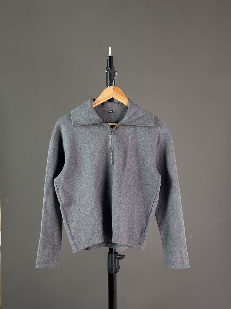 Uniqlo Grey Half Zip Sweatshirt (Category: Coats, Jackets and Outerwear) located in Malilipot. Submitted by brevsthrift (Listing ID 1465127275, Image 1). Description: - Brand: Uniqlo - Color: Grey - Style: Half-zip sweatshirt with a trendy big collar and metal zipper hardware - Material: 65% cotton, 35% polyester blend - Measurements: 21" (width) x 21" (length) - Features: Long sleeves and ribbed cuffs for a snug fit - Condition: Excellent .