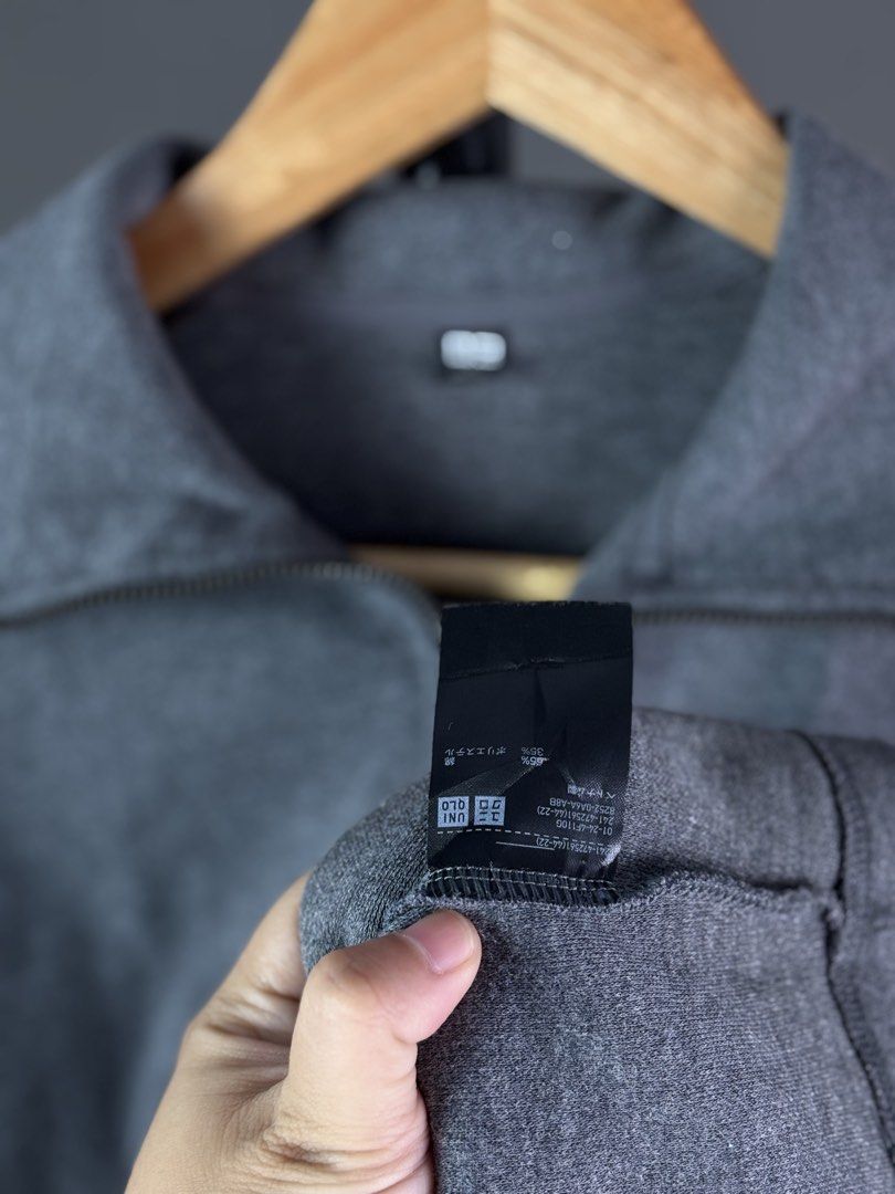 Uniqlo Grey Half Zip Sweatshirt (Category: Coats, Jackets and Outerwear) located in Malilipot. Submitted by brevsthrift (Listing ID 1465127275, Image 3). Description: - Brand: Uniqlo - Color: Grey - Style: Half-zip sweatshirt with a trendy big collar and metal zipper hardware - Material: 65% cotton, 35% polyester blend - Measurements: 21" (width) x 21" (length) - Features: Long sleeves and ribbed cuffs for a snug fit - Condition: Excellent .
