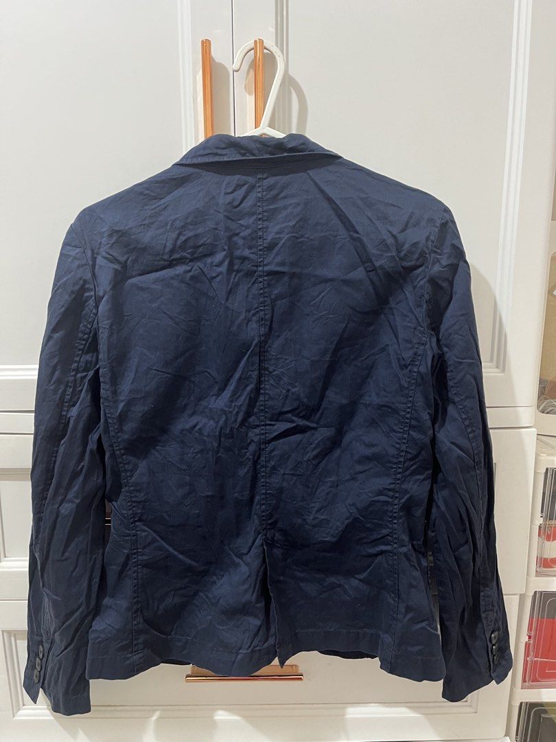 Uniqlo Navy Blue Cotton Blazer Size S (Category: Coats, Jackets and Outerwear) located in Pili. Submitted by jhamimin22 (Listing ID 1465061823, Image 2). Description: - Brand: Uniqlo - Color: Navy Blue - Size: S - Material: 100% Cotton - Closure: Single front button - Pockets: Two front patch pockets - Details: Three decorative buttons on each cuff, single back vent - Style: Casual, easy to throw on over any outfit - Condition: Clean tag with gar
