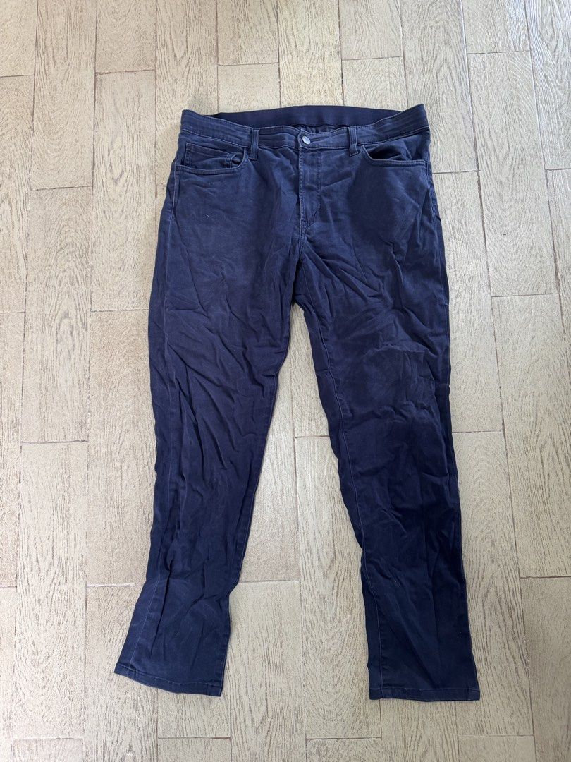 Uniqlo Navy Blue Stretch Pants Size L (Category: Trousers) located in Quezon City. Submitted by turak2020plus1 (Listing ID 1464971580, Image 1). Description: Brand: Uniqlo Measurements and Details: - Color: Navy Blue - Size: L (Fits waist 84 to 92 cm) - Outseam: 38in - Material: Comfortable cotton, rayon, and spandex blend for stretch and flexibility - Style: Classic five-pocket design with zip fly and button closure - Versatile: Easy to pair for