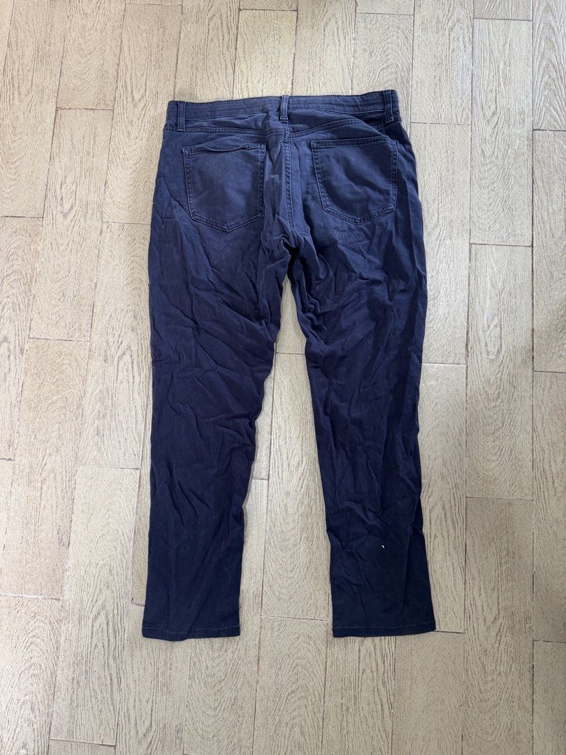 Uniqlo Navy Blue Stretch Pants Size L (Category: Trousers) located in Quezon City. Submitted by turak2020plus1 (Listing ID 1464971580, Image 2). Description: Brand: Uniqlo Measurements and Details: - Color: Navy Blue - Size: L (Fits waist 84 to 92 cm) - Outseam: 38in - Material: Comfortable cotton, rayon, and spandex blend for stretch and flexibility - Style: Classic five-pocket design with zip fly and button closure - Versatile: Easy to pair for