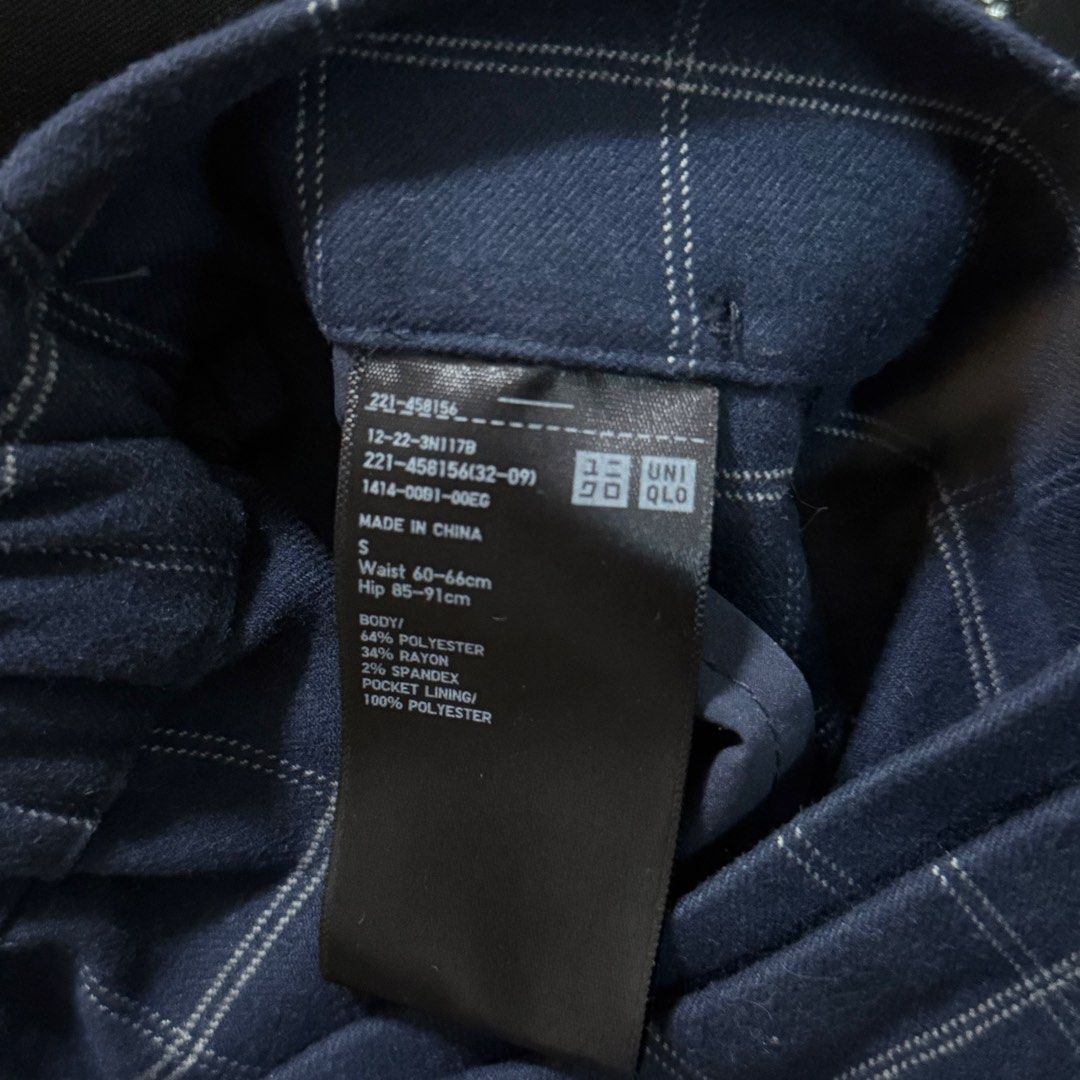 Uniqlo Navy Check Skort Size S (Category: Skirts) located in Quezon City. Submitted by pattb (Listing ID 1464971039, Image 3). Description: - Brand: Uniqlo - Style: Dark blue plaid skort (wrap skirt look in front, shorts underneath in back) - Size: S - Material: 64% polyester, 34% rayon, 2% spandex (with stretch) - Waist: 60-66cm (with elastic waistband) - Hips: 85-91cm - Details: Front button accent, Made in China - Condition: Excellent.