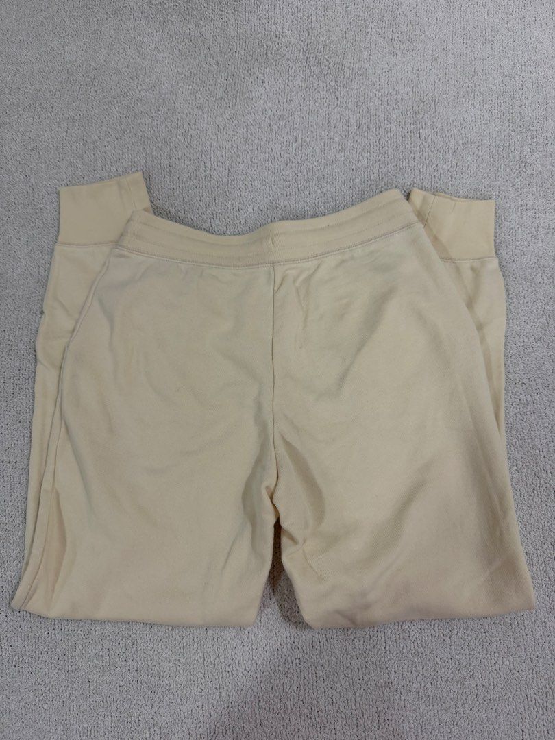 Uniqlo Sweatpants Joggers Size S (Category: Other Bottoms) located in Subic. Submitted by kittysclosetsale (Listing ID 1465016489, Image 2). Description: - Brand: Uniqlo - Item: Cream Joggers / Sweatpants - Size: S (Waist: 60-66cm, Height: 155/62A) - Material: Body: 86% Cotton, 14% Polyester | Ribbing: 82% Cotton, 18% Polyester - Made in: Indonesia - Features: Drawstring waistband with metal tips, two side pockets, and ribbed ankle cuffs.