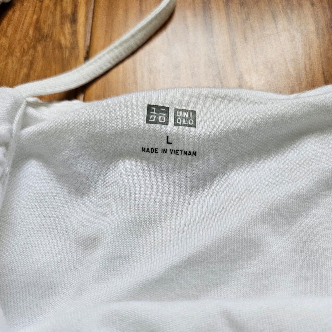 Uniqlo White Bubble Top (Category: Sleeveless) located in Quezon City. Submitted by arydeclutters (Listing ID 1465010514, Image 2). Description: RFS: need funds and decluttering LAST PRICE POSTED!! QC area MOP: GCash, Maya, GoTyme MOD: JNT, Lalamove, LBC ONLY SF shouldered by buyer.