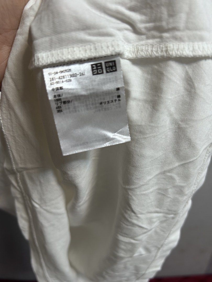 Uniqlo White Tank Top Size M (Category: Sleeveless) located in General Trias. Submitted by theosellye (Listing ID 1465170570, Image 3). Description: - Brand: Uniqlo - Size: M - Color: Solid White - Material: 100% cotton body, cotton-polyester blend ribbing - Design: Classic crew neckline, sleeveless, minimalist style - Condition: Brand new with tag attached - Origin: Made in China - Versatile basic, easy to mix and match with any outfit.