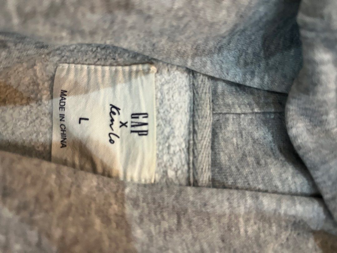 Unisex GAP hoodie (Category: Coats, Jackets and Outerwear) located in Batangas. Submitted by gavsandrix (Listing ID 1465050764, Image 3). Description: - Brand: GAP x Keroro - Type: Unisex Hoodie / Pullover - Color: Heather Grey - Size: Large (L) - Design: Unique quirky cartoon character graphic print on the front - Features: Attached hood and front kangaroo pocket - Condition: Excellent pre-owned condition, cozy and ready to wear.