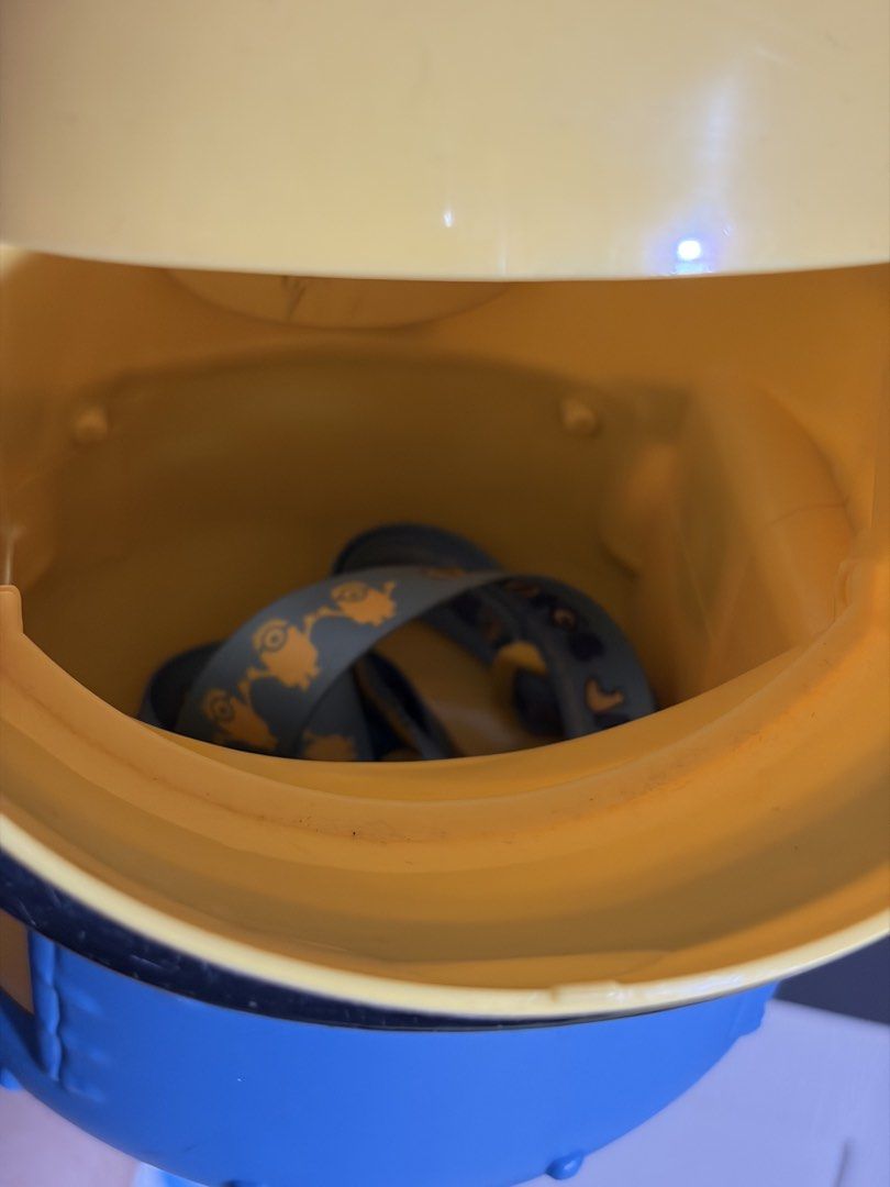 Universal Studios Japan Minion Popcorn Bucket (Category: Character Goods) located in Plaridel. Submitted by moddedjarvis (Listing ID 1465170585, Image 3). Description: - Authentic Universal Studios Japan merchandise -Complete with USJ lace -Issue: yellowish eyes - Iconic Minion character design with large silver goggles - Open-mouth top lid mechanism - Comes with original themed carrying strap - Must-have collectible for Despicable Me fans.