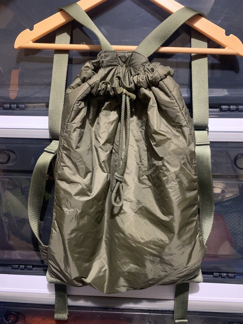 Unqlo Nylon bag pack (Category: Backpacks) located in Itogon. Submitted by kitkayt (Listing ID 1465066212, Image 1). Description: - Brand/Model: Uniqlo U Nylon Backpack - Color: Olive Green / Sage - Material: 100% Nylon body/lining with polyester padding - Closure: Convenient drawstring top with adjustable straps - Features: Includes interior zippered pocket for small essentials - Condition: Excellent pre-owned condition.