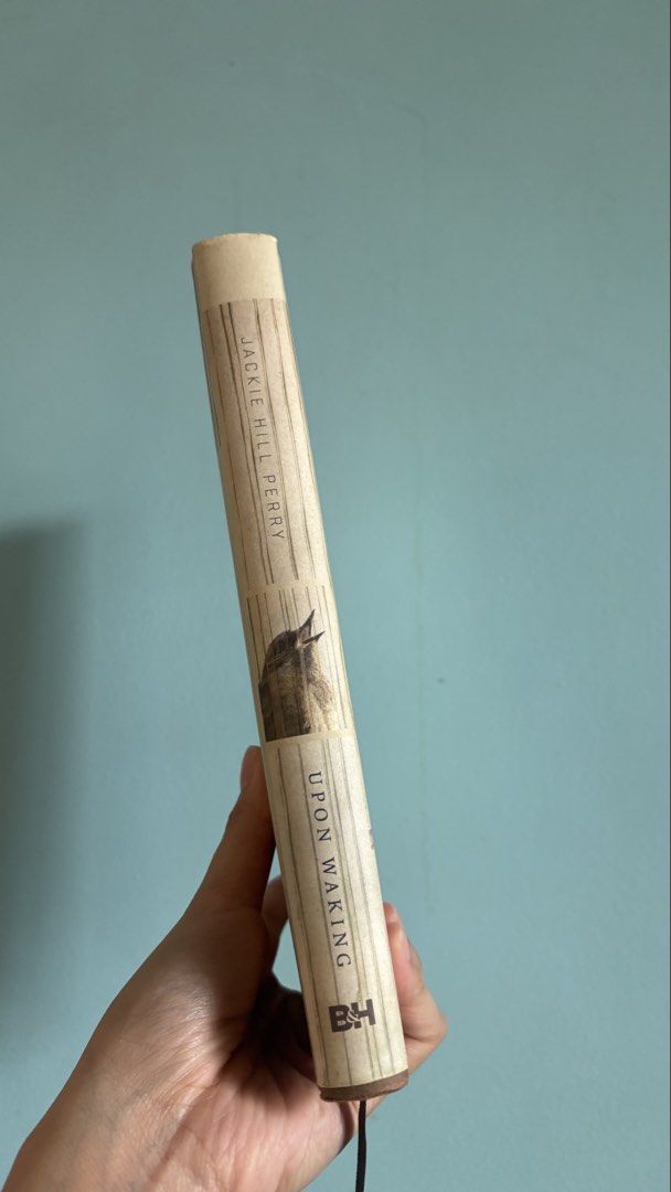 Upon Waking by Jackie Hill Perry Devotional Book (Category: Storybooks) located in Las Pinas. Submitted by badudisparku (Listing ID 1465037973, Image 3). Description: - Title: Upon Waking by Jackie Hill Perry - Format: Hardcover with attached ribbon bookmark - Publisher: B&H Publishing Group - Content: 60-day scripture-soaked daily devotional for spiritual growth - Condition: Clean pages inside (Day 24 visible), with a minor store sticker on the 