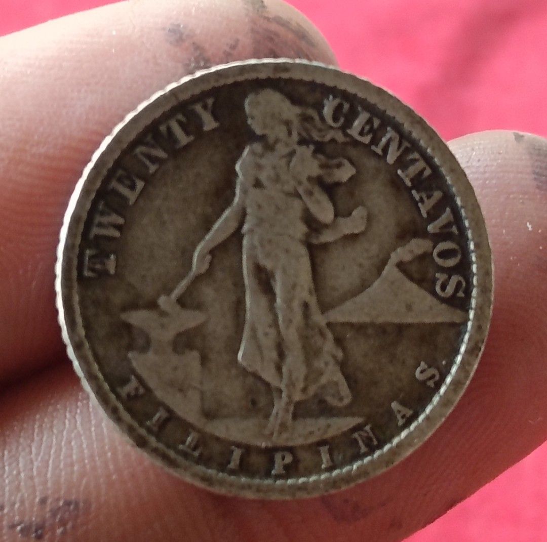 US Philippines 1918 Twenty Centavos Silver Coin (Category: Currency) located in Batangas. Submitted by swiftstone.96924b (Listing ID 1465002468, Image 2). Description: silver coin - Vintage 1918 Twenty Centavos Filipinas coin - Features US eagle and shield on the obverse - Reverse shows standing figure and iconic volcano - Genuine antique with natural patina and age-appropriate wear - Ideal piece for numismatists and Philippine history collectors