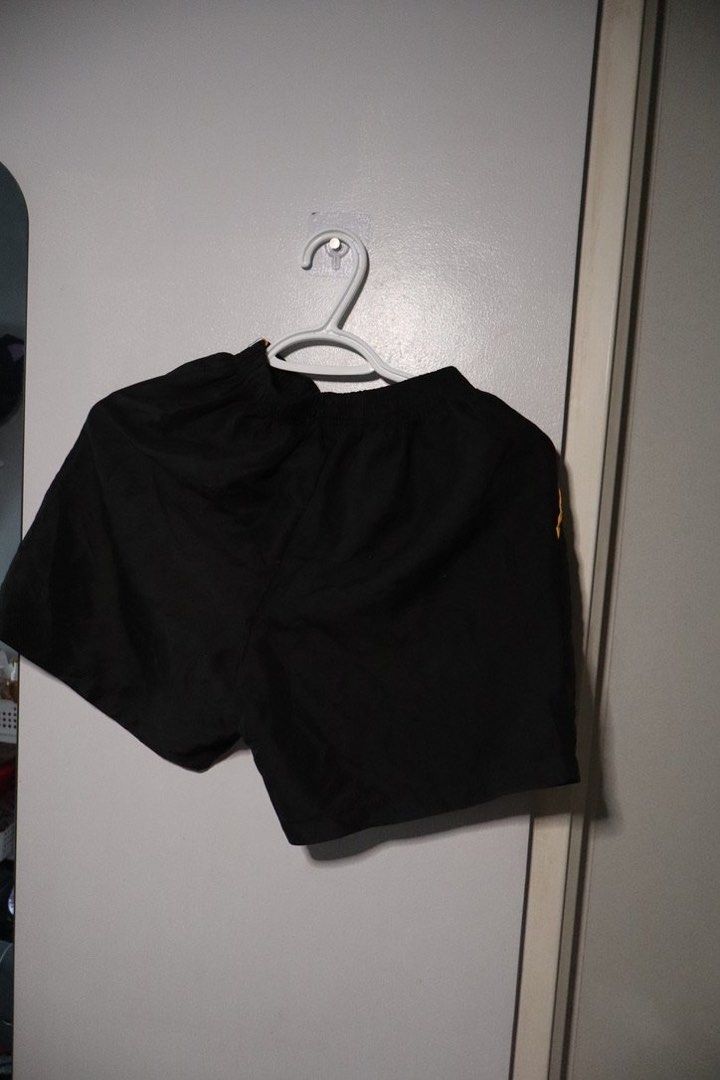 UST Table Tennis shorts (Category: Activewear) located in Manila. Submitted by leivic (Listing ID 1465061097, Image 2). Description: - Color: Black with yellow side piping - Team: Official UST Growling Tigers logo on the left leg - Fit: Comfortable elastic waistband - Material: Lightweight and easy to move in.