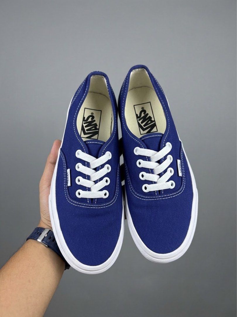 Vans Authentic Navy Blue Canvas Sneakers (Category: Sneakers) located in Bacolod City. Submitted by kitcarsonduff (Listing ID 1465109025, Image 1). Description: - Authentic Navy Blue Vans low-top sneakers - Classic canvas upper with white contrast stitching and matching laces - Iconic white rubber waffle outsoles with red 'Off The Wall' heel license plate - Uppers are clean and well-maintained - Minor wear on the soles, plenty of life left.