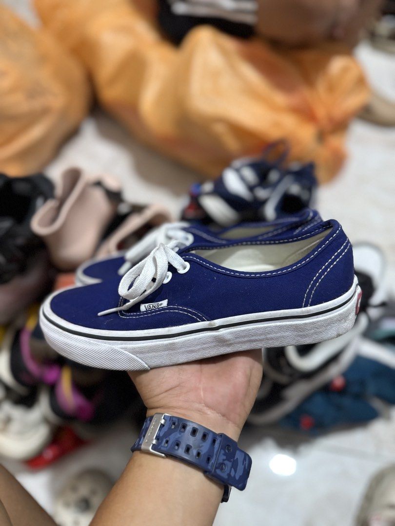 Vans Authentic Navy Blue Canvas Sneakers (Category: Sneakers) located in Bacolod City. Submitted by kitcarsonduff (Listing ID 1465109025, Image 3). Description: - Authentic Navy Blue Vans low-top sneakers - Classic canvas upper with white contrast stitching and matching laces - Iconic white rubber waffle outsoles with red 'Off The Wall' heel license plate - Uppers are clean and well-maintained - Minor wear on the soles, plenty of life left.