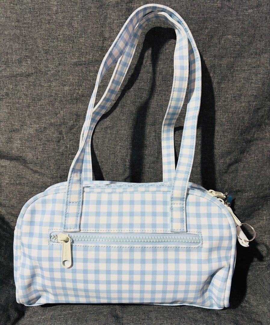 Vanwalk Blue Shoulder Bag with Dolphin Charm (Category: Shoulder Bags) located in Quezon City. Submitted by mjmic (Listing ID 1465019305, Image 3). Description: - Brand: Vanwalk - Design: Blue and white gingham (Cute pastel aesthetic) - Pockets: Double front pockets, zipped back pocket, and internal zip pocket - Condition: Super clean interior and exterior - Includes: Original blue whale acrylic charm, branded dust bag, and shape-keeping stuffing