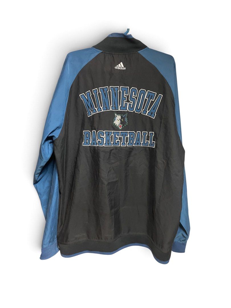 Vintage Adidas Minnesota Jacket (Category: Coats, Jackets and Outerwear) located in Manila. Submitted by 2002kid (Listing ID 1465069369, Image 2). Description: - Brand: Adidas - Team: Minnesota Timberwolves - Color: Black and blue - Size: Large - Details: Embroidered wolf logo on chest, large Minnesota Basketball lettering and wolf logo on back - Features: Full-zip front, high collar, ribbed cuffs and hem - Condition: Clean, graphics and embroide