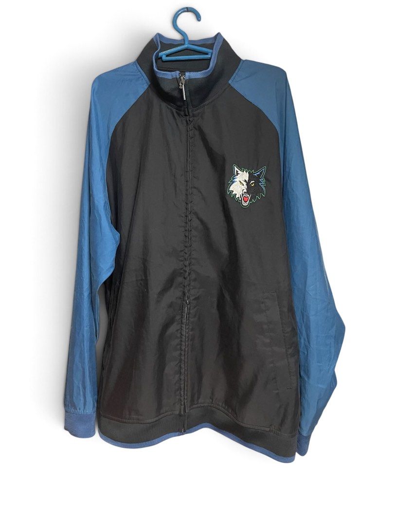 Vintage Adidas Minnesota Jacket (Category: Coats, Jackets and Outerwear) located in Manila. Submitted by 2002kid (Listing ID 1465069369, Image 1). Description: - Brand: Adidas - Team: Minnesota Timberwolves - Color: Black and blue - Size: Large - Details: Embroidered wolf logo on chest, large Minnesota Basketball lettering and wolf logo on back - Features: Full-zip front, high collar, ribbed cuffs and hem - Condition: Clean, graphics and embroide
