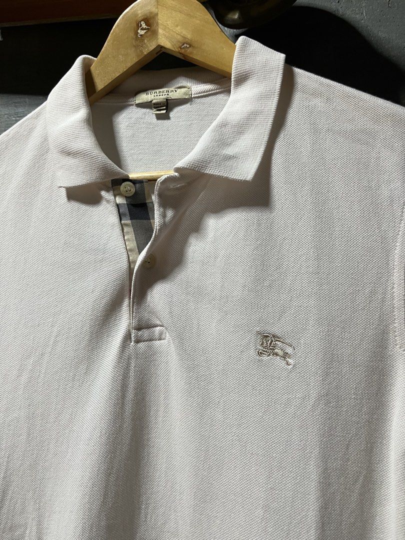 Vintage Burberry polo (Category: Tshirts & Polo Shirts ) located in San Jose. Submitted by thriftfindsarchive (Listing ID 1465101659, Image 2). Description: Size S Width 18 Length 27 Issue minimal pink ink not visible good condition 9/10 color rate Fave ✨.