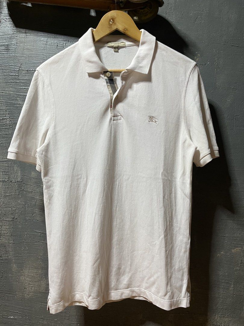 Vintage Burberry polo (Category: Tshirts & Polo Shirts ) located in San Jose. Submitted by thriftfindsarchive (Listing ID 1465101659, Image 1). Description: Size S Width 18 Length 27 Issue minimal pink ink not visible good condition 9/10 color rate Fave ✨.