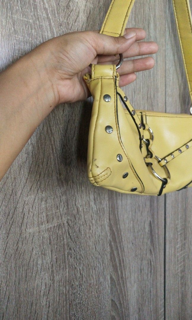 Vintage Chateau Yellow Studded Shoulder Bag (Category: Shoulder Bags) located in San Fernando. Submitted by luckyflower.e9e5ed (Listing ID 1464852501, Image 2). Description: Brand: Chateau Condition: Well used (please read details below) Description: Selling this chic, Y2K-style yellow studded shoulder bag from Chateau. Perfect for adding a pop of color and an edgy vibe to your outfits! ⚠️ CONDITION NOTE / FLAW DETAILS: Please swipe to the last p