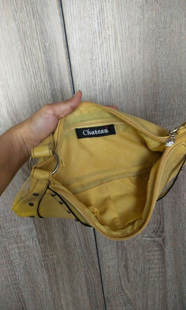 Vintage Chateau Yellow Studded Shoulder Bag (Category: Shoulder Bags) located in San Fernando. Submitted by luckyflower.e9e5ed (Listing ID 1464852501, Image 3). Description: Brand: Chateau Condition: Well used (please read details below) Description: Selling this chic, Y2K-style yellow studded shoulder bag from Chateau. Perfect for adding a pop of color and an edgy vibe to your outfits! ⚠️ CONDITION NOTE / FLAW DETAILS: Please swipe to the last p