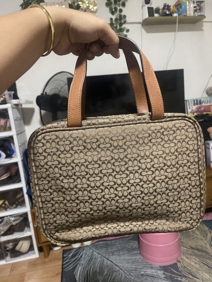 Vintage Coach Travel bag (Category: Purses & Pouches) located in Manila. Submitted by pray.loved.life (Listing ID 1465026183, Image 3). Description: -Coach Signature C BRWN Jacquard Canvas Leather Handle Travel Cosmetic Makeup Bag -Normal signs of usage only.