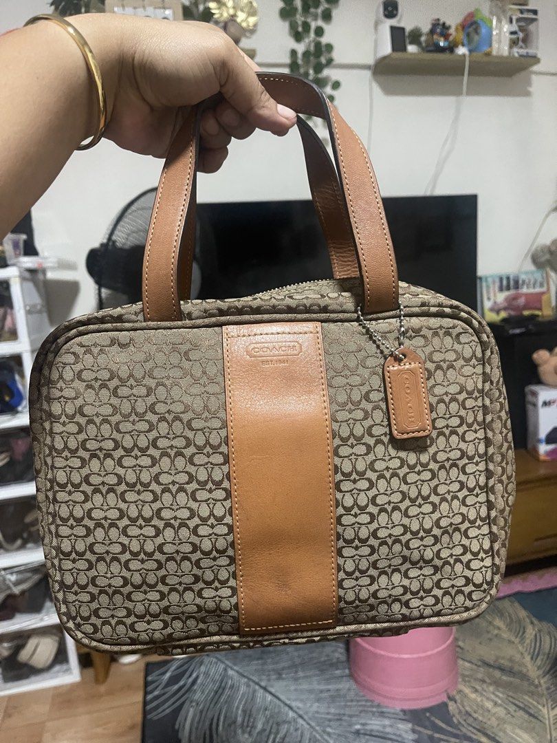 Vintage Coach Travel bag (Category: Purses & Pouches) located in Manila. Submitted by pray.loved.life (Listing ID 1465026183, Image 1). Description: -Coach Signature C BRWN Jacquard Canvas Leather Handle Travel Cosmetic Makeup Bag -Normal signs of usage only.