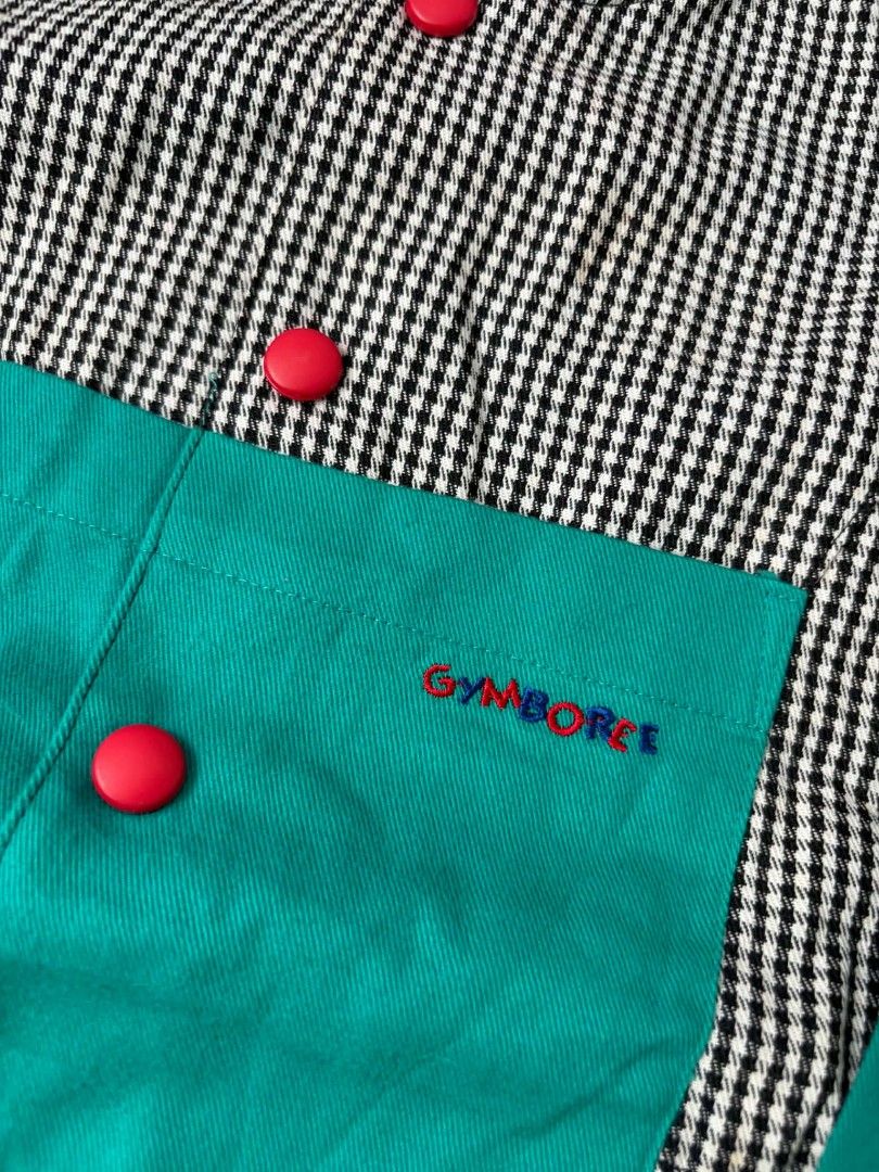 Vintage Gymboree (Category: Babies & Kids Fashion) located in Las Pinas. Submitted by pinkpototo36548 (Listing ID 1465070800, Image 2). Description: - Vintage Gymboree jumpsuit for little ones - Black and white houndstooth pattern with bold red and teal colorblock panels - Features red front buttons and an embroidered logo on the chest pocket - Stylish ribbed cuffs in black, red, and green at wrists and ankles - Rare and uniquely fun statement pi