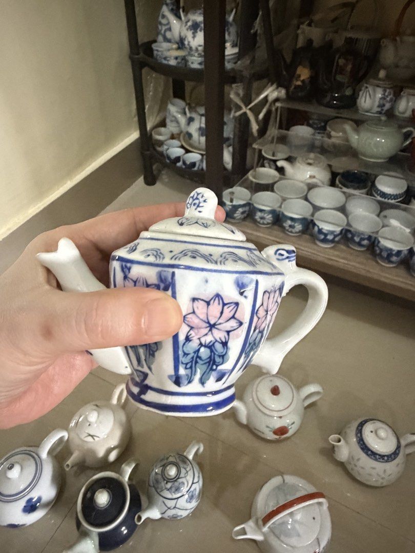 Vintage Mini Ceramic Teapot Collectible Assorted Designs (Category: Coffee & Tea Tableware) located in Manila. Submitted by ginatan197811 (Listing ID 1464980431, Image 2). Description: - Mini ceramic teapot collection with matching lids - Features hand-painted blue, white, and floral patterns - Perfect cute display pieces or miniature tea set collectibles - Great shelf decor for tea lovers - Multiple styles available.