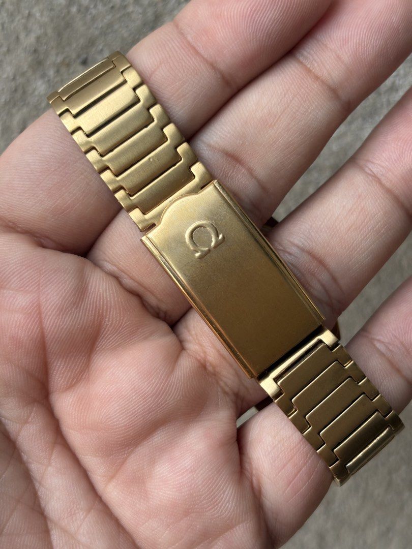 Vintage Omega Seamaster Automatic Gold Watch (Category: Luxury Watches) located in Manila. Submitted by therealhandsoftime (Listing ID 1465053927, Image 2). Description: - Authentic vintage Omega Seamaster Automatic watch in a striking gold-tone finish - Distinctive tonneau case design paired with a matching integrated gold bracelet - Sunburst dial equipped with sleek baton markers, hour/minute hands, and a 3 o'clock day-date window - Signed crow