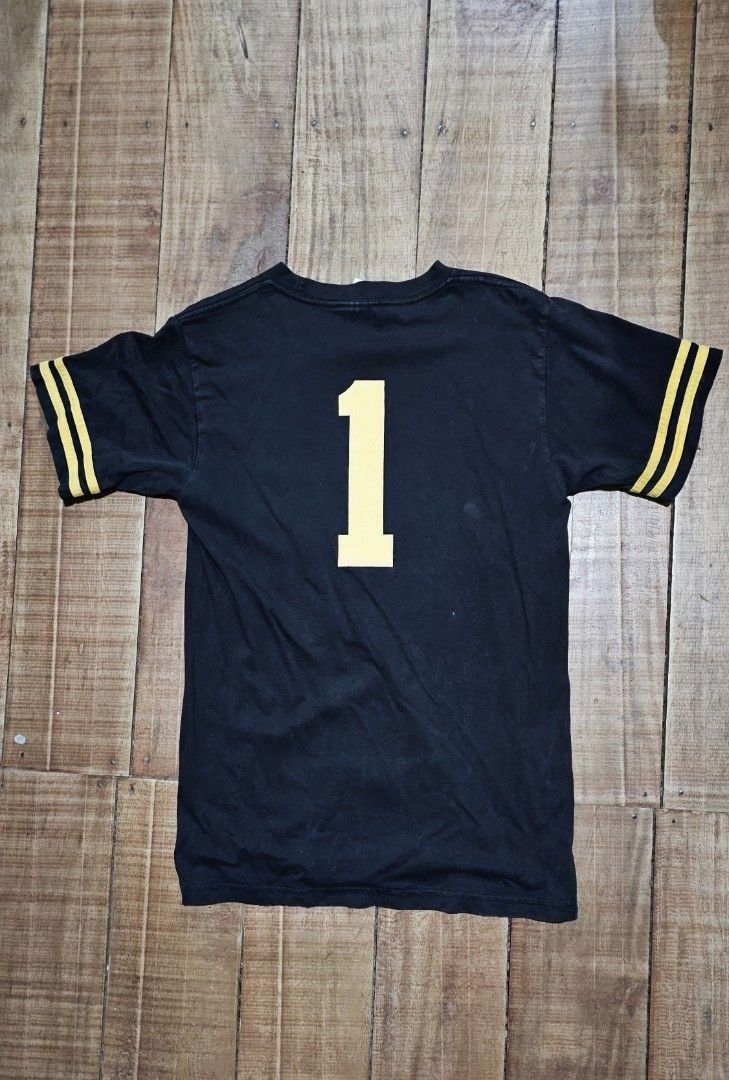 Vintage Stüssy Knowledge Is King Ringer Tee (Category: Tshirts & Polo Shirts ) located in Kibawe. Submitted by Thrift_ni_Babac (Listing ID 1465005327, Image 2). Description: - Bootleg Stüssy ringer tee on a Hanes Beefy-T label - Color: Black with yellow sleeve stripes - Graphics: 'Knowledge Is King' front print with yellow figure/red crown, and large number 1 on the back - Material: 100% pre-shrunk cotton - Dimes: 18W x 26L - Condition: Shows nor