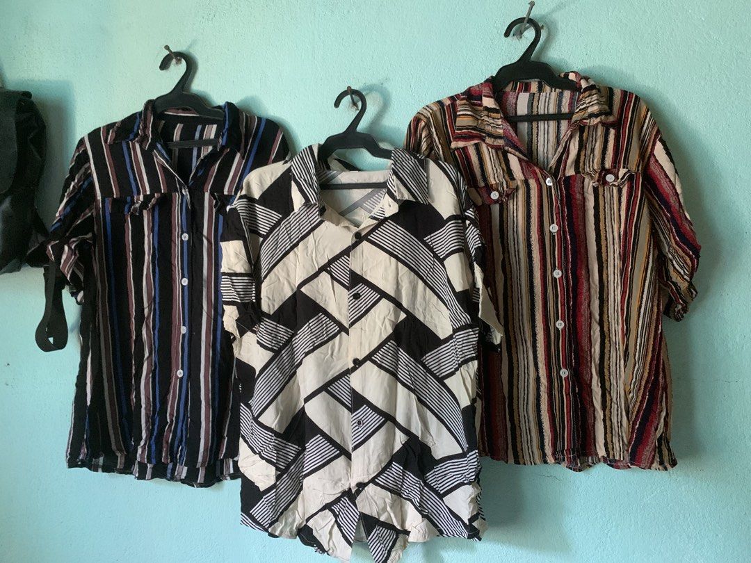 3 for 100 Vintage Style Button Down Shirts Bundle or Individual (Category: Blouses) located in Daraga. Submitted by ryrilim (Listing ID 1465013684, Image 1). Description: - Set of 3 vintage-style short sleeve button-downs - Prints: Colorful stripe, black & blue stripe, and black & white geometric abstract - Features: Front button closures, classic shirt collars, and convenient chest pockets - Fabric: Lightweight and breathable, ideal for casual e