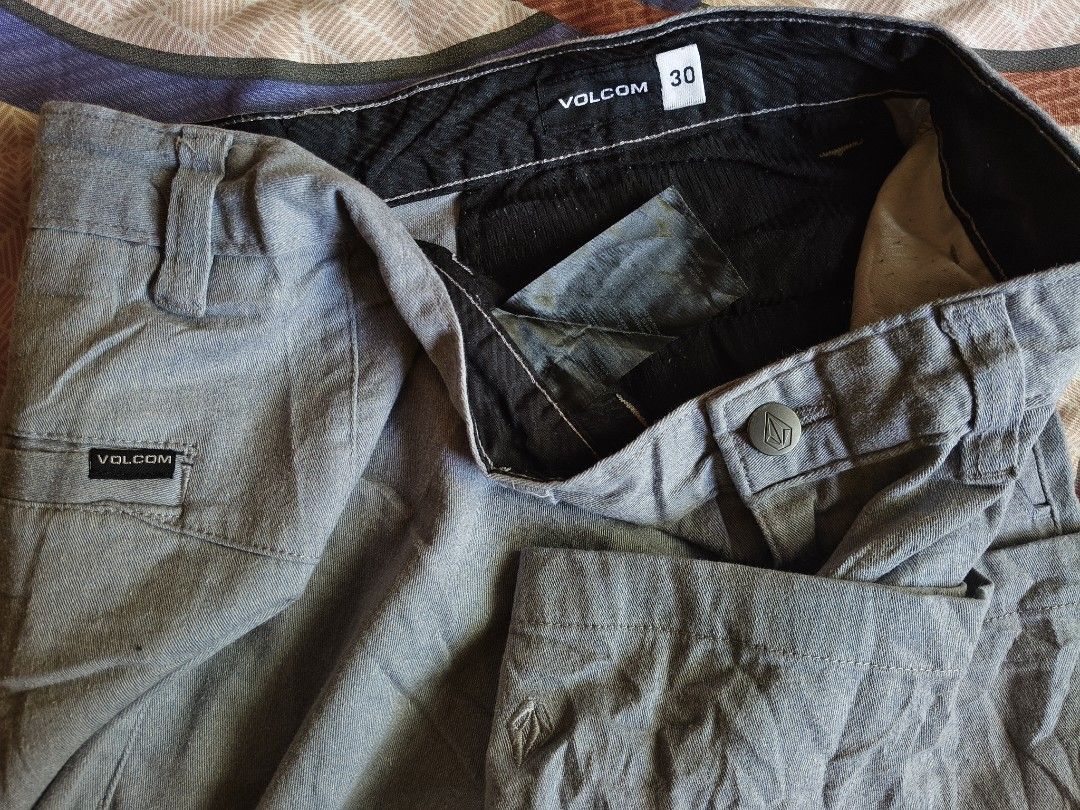 Volcom Men's Grey Casual Shorts Size 30 (Category: Shorts) located in Baguio. Submitted by thriftjc (Listing ID 1464973448, Image 3). Description: - Brand: Volcom - Size: 30 - Color: Grey - Closure: Standard button closure with zip fly - Features: Belt loops and side pockets with Volcom logo tags - Condition: Clean fabric with no major wear - Style: Great everyday casual pair.