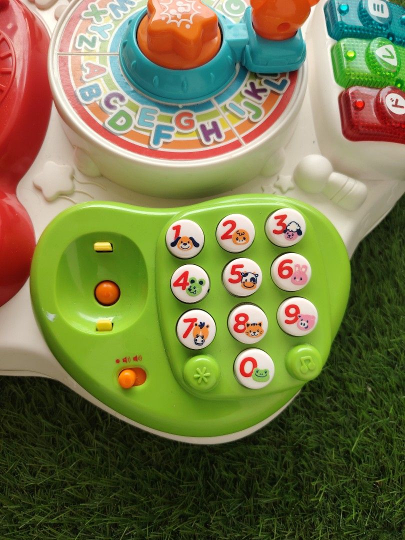 VTech Interactive Activity Learning Table Top Toy (Category: Infant Playtime) located in Nusajaya. Submitted by qalbebe (Listing ID 1464981513, Image 2). Description: Stand dgn phone je xde ,lain sound and lampu semua function..boleh pm utk video - VTech interactive learning toy panel for toddlers - Features a colorful steering wheel, spinning gears, and alphabet wheel - Animal telephone keypad, flip-book, and piano keys with Japanese characters 
