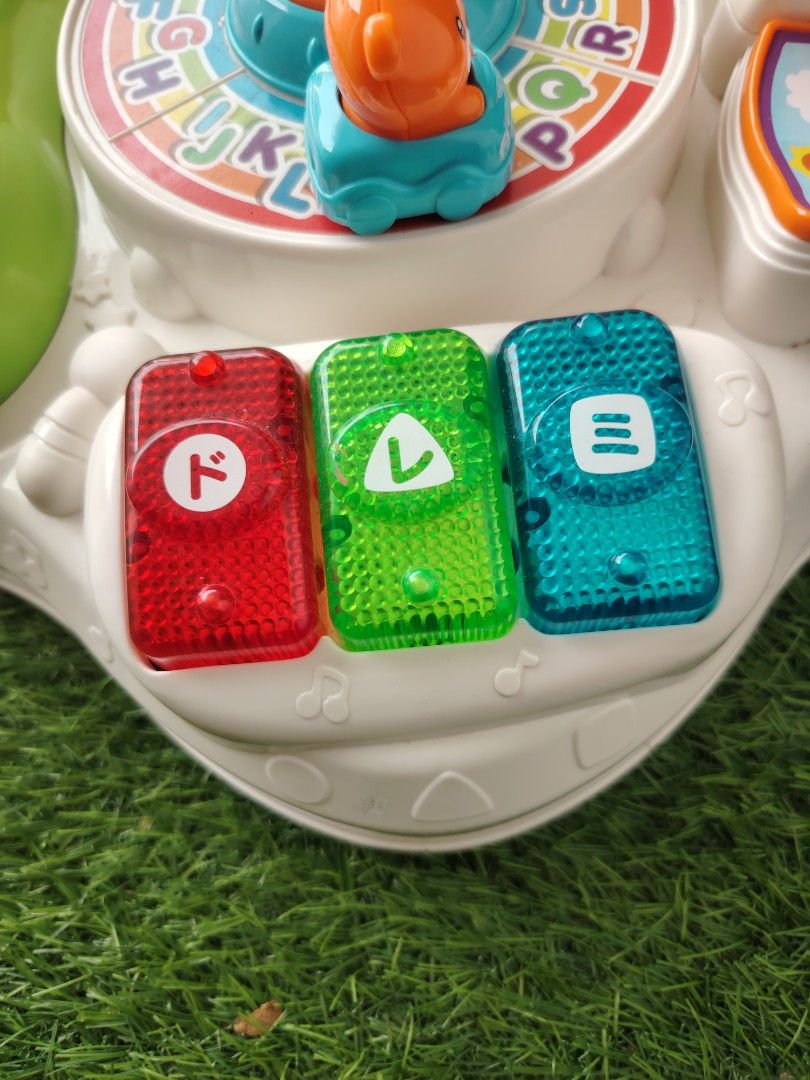 VTech Interactive Activity Learning Table Top Toy (Category: Infant Playtime) located in Nusajaya. Submitted by qalbebe (Listing ID 1464981513, Image 3). Description: Stand dgn phone je xde ,lain sound and lampu semua function..boleh pm utk video - VTech interactive learning toy panel for toddlers - Features a colorful steering wheel, spinning gears, and alphabet wheel - Animal telephone keypad, flip-book, and piano keys with Japanese characters 