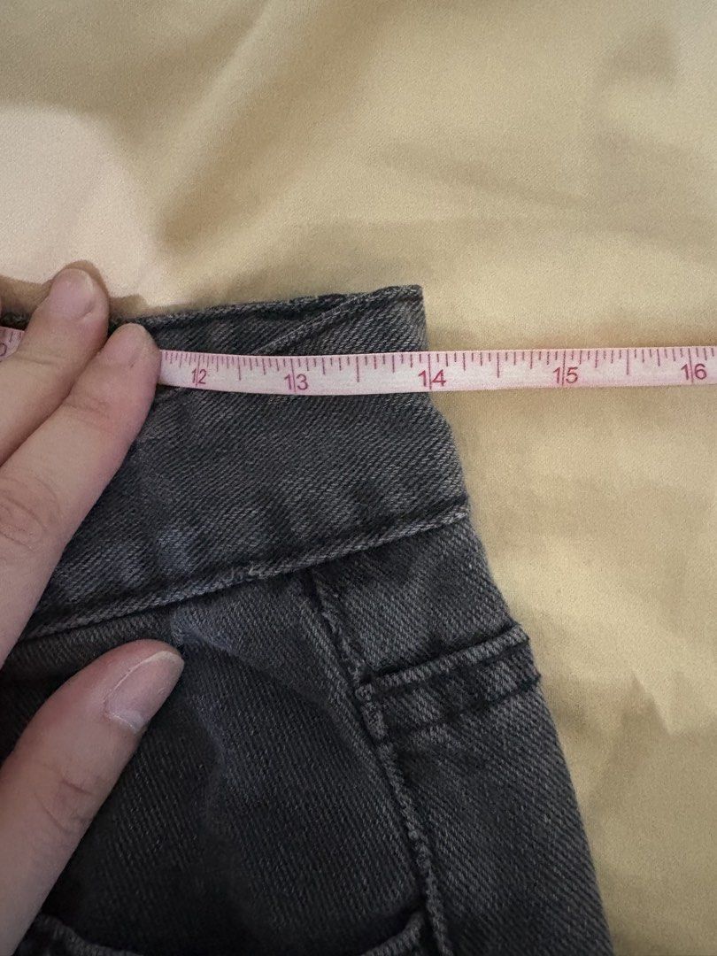 Washed Black Denim Jeans with Puzzle Patch Embroidery (Category: Jeans) located in Quezon City. Submitted by bluefrenchorn (Listing ID 1465028100, Image 2). Description: - Color & Wash: Dark grey washed denim - Fit: Relaxed straight leg - Design: Cute white puzzle piece outline embroidery on front legs - Details: Standard button and zipper fly, belt loops, classic five-pocket styling - Measurements: Approx. 14 inches flat waist, 38.5 inches total