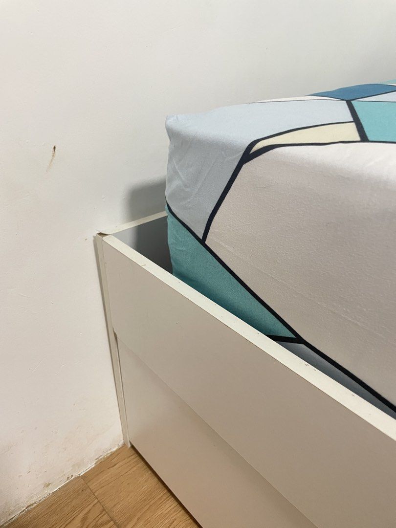 White 2 Drawer Single Bed Frame & Matress (Category: Bed Frames & Mattresses) located in Los Banos. Submitted by reinabee88 (Listing ID 1464968916, Image 2). Description: LOC: Los Baños, Laguna - Type: White single bed frame (wooden) - Size: 36" x 75" (approx. 193 x 93 x 30 cm) - Storage: 2 pullout drawers underneath - Design: Clean, modern look, no headboard - Inclusion: 8-inch Spring Mattress (used for 1 year only) with New Matress Cover includ