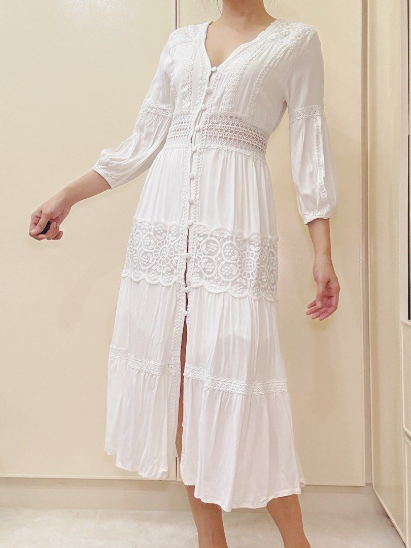 White lace trim midi dress boho button down (Category: Dresses) located in Malvar. Submitted by lorenplaton (Listing ID 1465003429, Image 3). Description: - Color: White - Style: Midi dress with V-neckline and functional front buttons - Details: Sheer lace waist panel and stunning floral embroidery on the skirt tier - Sleeves: 3/4 sleeves with comfortable gathered cuffs - Fabric: cotton- lined - Fit: True to size - Condition: Excellent, no flaws 