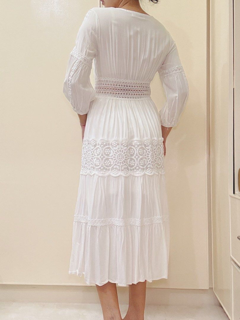 White lace trim midi dress boho button down (Category: Dresses) located in Malvar. Submitted by lorenplaton (Listing ID 1465003429, Image 2). Description: - Color: White - Style: Midi dress with V-neckline and functional front buttons - Details: Sheer lace waist panel and stunning floral embroidery on the skirt tier - Sleeves: 3/4 sleeves with comfortable gathered cuffs - Fabric: cotton- lined - Fit: True to size - Condition: Excellent, no flaws 