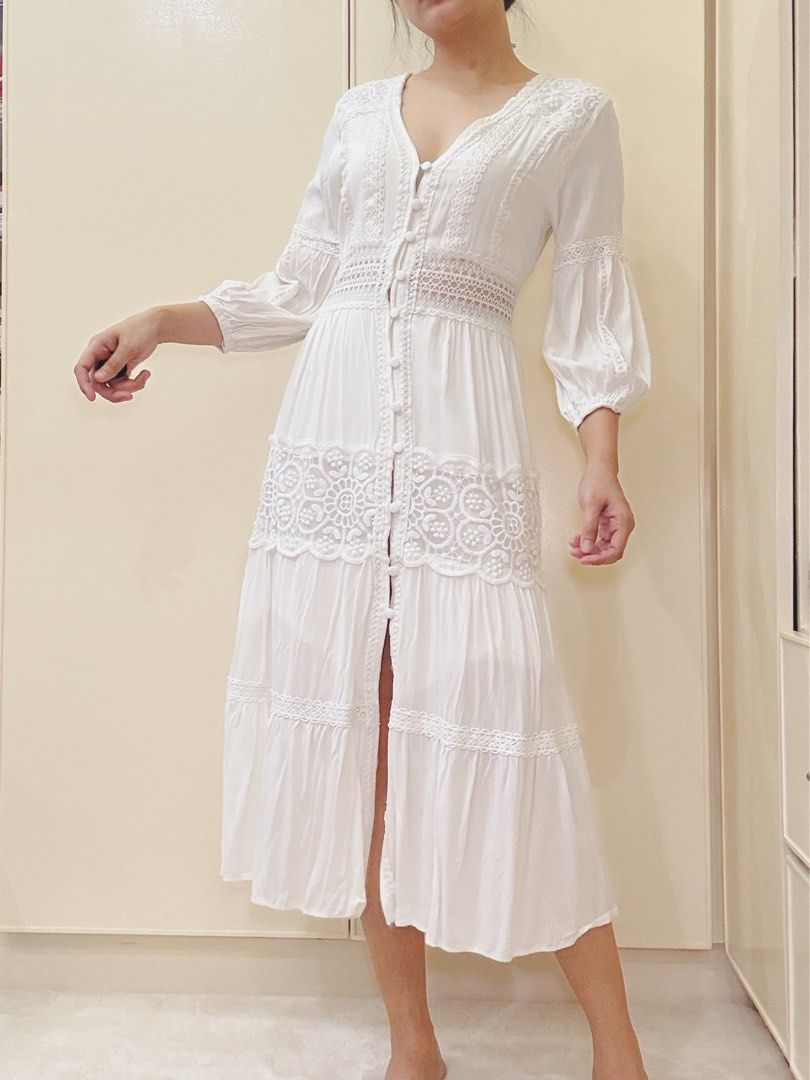 White lace trim midi dress boho button down (Category: Dresses) located in Malvar. Submitted by lorenplaton (Listing ID 1465003429, Image 1). Description: - Color: White - Style: Midi dress with V-neckline and functional front buttons - Details: Sheer lace waist panel and stunning floral embroidery on the skirt tier - Sleeves: 3/4 sleeves with comfortable gathered cuffs - Fabric: cotton- lined - Fit: True to size - Condition: Excellent, no flaws 