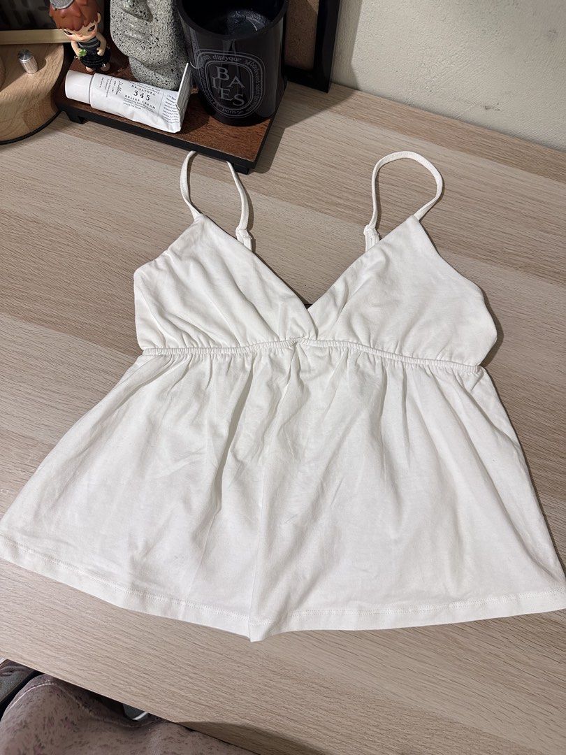 White peplum top (Category: Sleeveless) located in Dasmarinas. Submitted by lovedbyryl (Listing ID 1465073206, Image 1). Description: personal favorite top. i have it in every color hahaha Available in XS, medium, large, and XL.