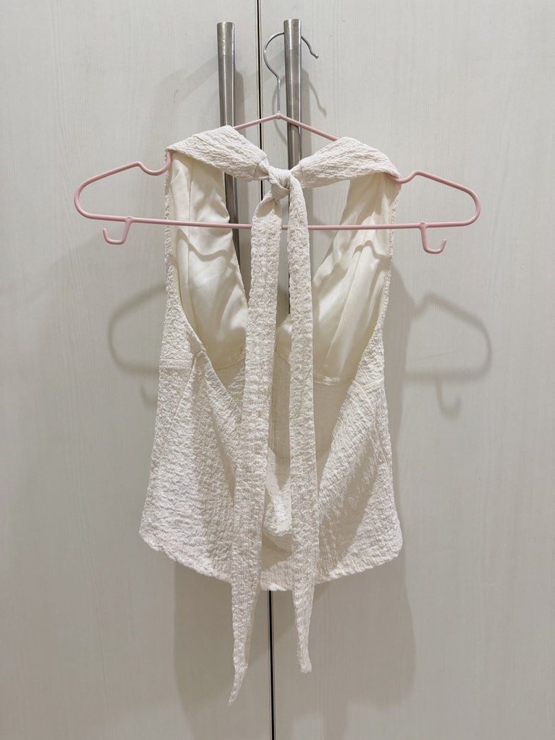White textured halter top with front buttons (Category: Sleeveless) located in Manila. Submitted by rhei.preloved (Listing ID 1465076424, Image 3). Description: USED ONCE ‼️.