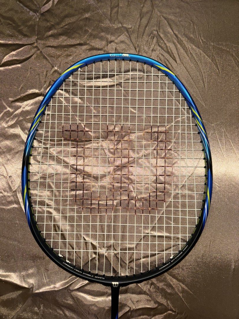 Wilson Recon P2500 Badminton Racket (Category: Racket and Ball Sports) located in Manila. Submitted by ledgeve (Listing ID 1465030311, Image 3). Description: - Model: Wilson Recon P2500 badminton racket - Design: Stylish blue and black frame with striking yellow accents - Technology: Built with Power Skin Composite and High Modulus Carbon for enhanced performance - Ready to Play: Pre-strung with the iconic Wilson logo stamped and a fresh black gr