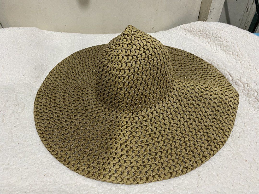 Woven Straw Sun Hat Wide Brim Beach Hat (Category: Hats & Beanies) located in Manila. Submitted by resi.diaz (Listing ID 1465040878, Image 1). Description: - Color: Brown - Material: Lightweight woven straw - Design: Wide brim with open weave pattern for maximum airflow - Comfort: Includes white interior sweatband - Portability: Easy to pack, ideal for beach trips and outdoor walks - Condition: Brand new/Mint.