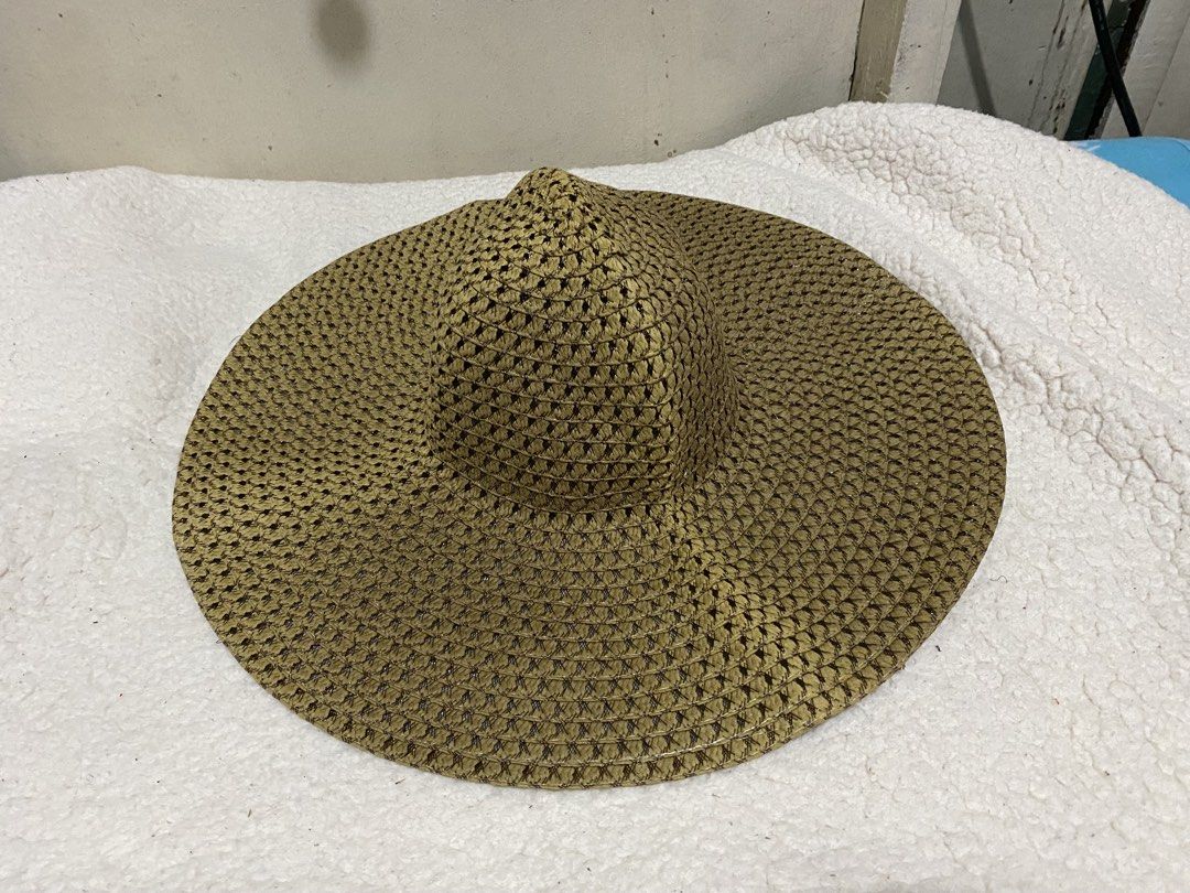 Woven Straw Sun Hat Wide Brim Beach Hat (Category: Hats & Beanies) located in Manila. Submitted by resi.diaz (Listing ID 1465040878, Image 2). Description: - Color: Brown - Material: Lightweight woven straw - Design: Wide brim with open weave pattern for maximum airflow - Comfort: Includes white interior sweatband - Portability: Easy to pack, ideal for beach trips and outdoor walks - Condition: Brand new/Mint.