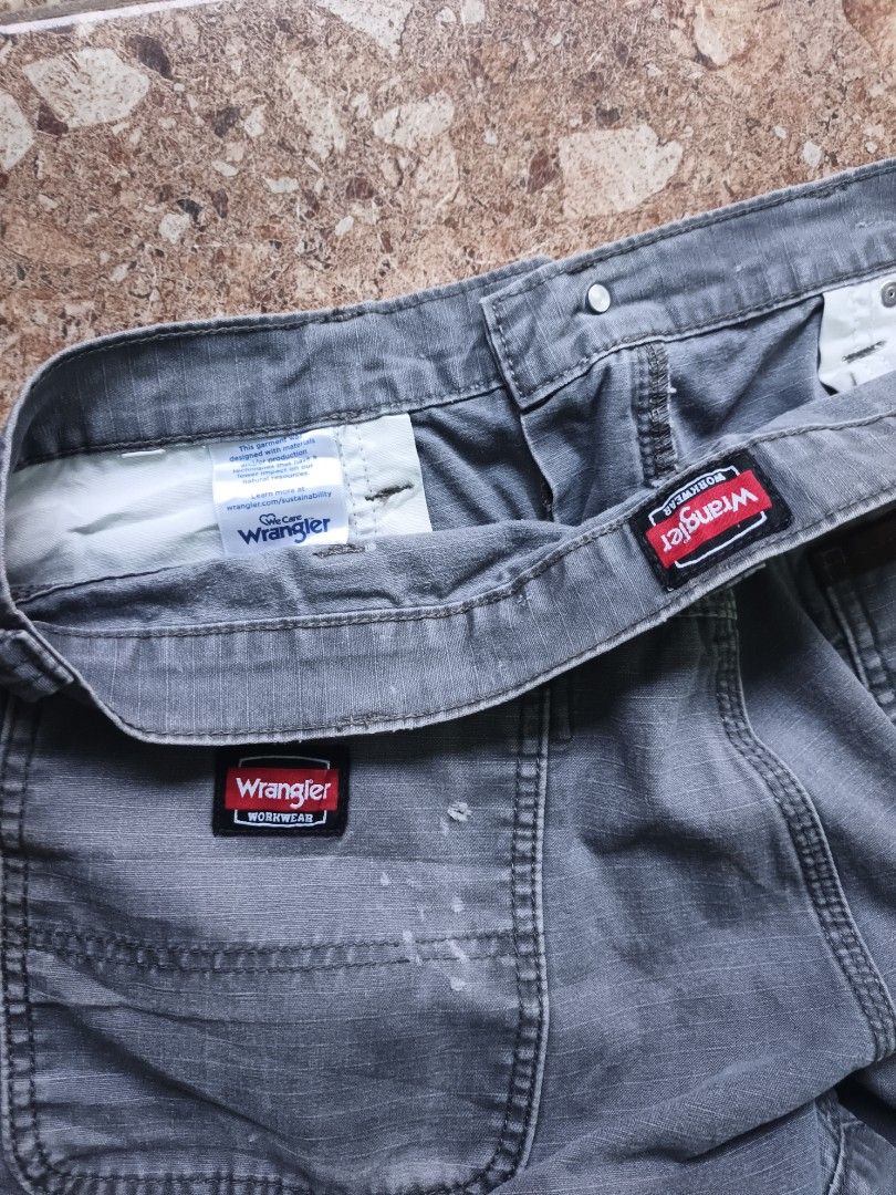 Wrangler Workwear Grey Cargo Shorts (Category: Shorts) located in Manila. Submitted by leerarefinds (Listing ID 1465083000, Image 3). Description: -Brand/Item: Wrangler Workwear cargo shorts - Color: Grey - Features: Multiple side and back pockets, sturdy fabric construction, belt loops - Condition: Good, with small paint splatter marks on the back pocket - Best for: Outdoor work or casual everyday wear.