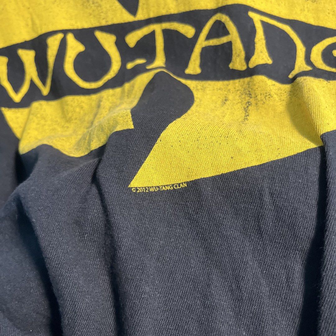 Wutang shirt (Category: Tshirts & Polo Shirts ) located in Santo Tomas. Submitted by niftynook_22 (Listing ID 1464987218, Image 3). Description: Excellent condition 9/10 color rate 19.5 (can stretch to 20.5 ) x 27.5 No issue .