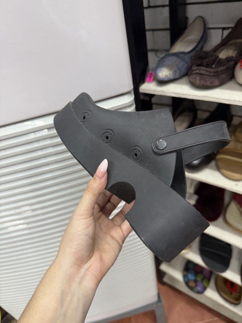 Xocol Black Platform Clogs with Slingback Strap (Category: Flats & Sandals) located in Manila. Submitted by fastlion.584bdf (Listing ID 1465068248, Image 3). Description: - Brand: Xocol - Style: Black platform clogs, slip-on with chunky heel - Material: Durable solid rubber throughout - Fit: Adjustable back strap with side button closures - Sole: Textured sole for good grip - Condition: Very minor scuffing on bottom treads from regular wear.