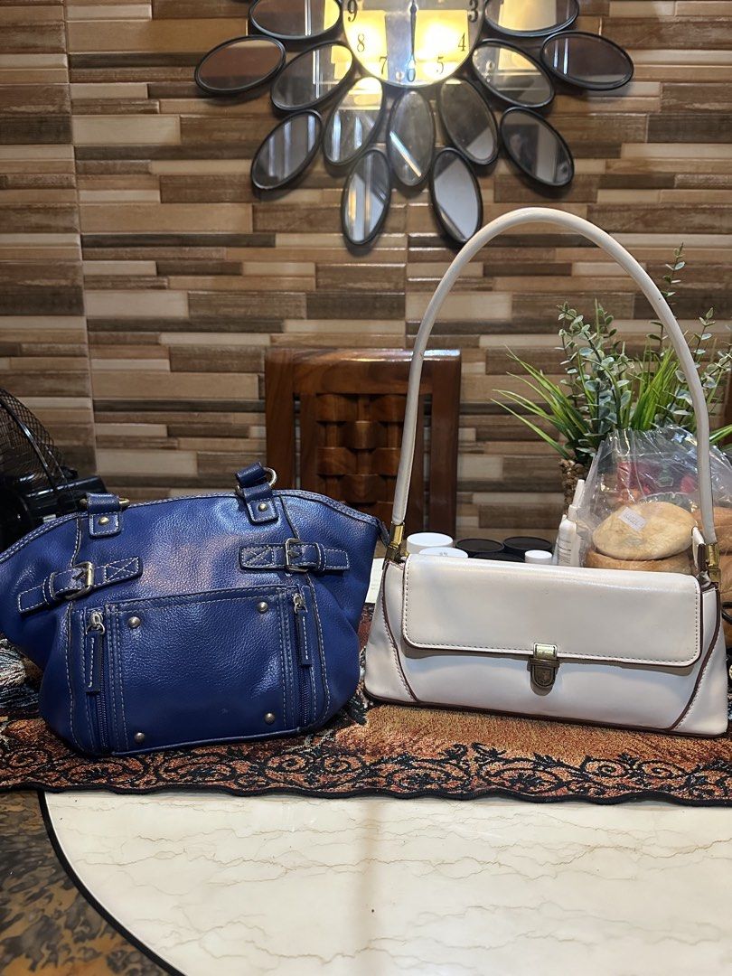 Y2K Aesthetic Bag Bundle 2 (Category: Shoulder Bags) located in Caloocan City. Submitted by kristel3094 (Listing ID 1465035049, Image 1). Description: Textured blue handbag with double shoulder straps. Front flap pocket with dual zippers and decorative metal studs. Two side buckle straps near the top handles. Zipper closure across the top keeps your belongings secure. Contrast white stitching throughout. Plenty of room for daily essentials..