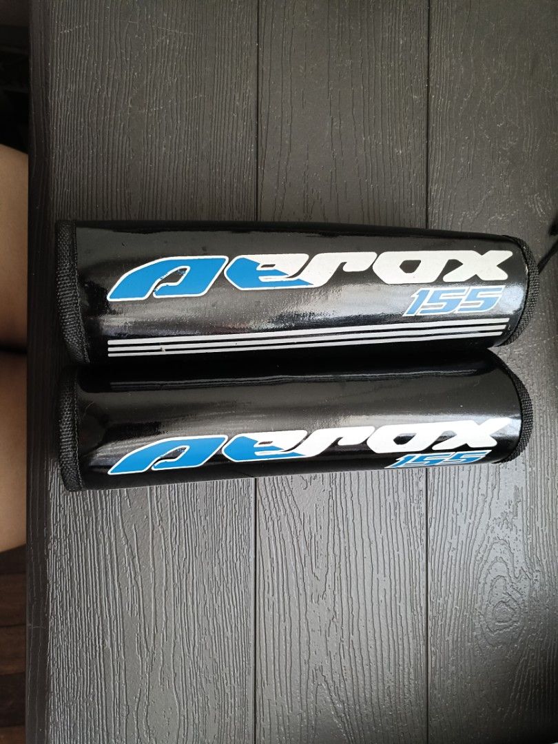 Yamaha Aerox 155 Shock Covers Protector (Category: Body Parts and Accessories) located in Quezon City. Submitted by cataleya0723 (Listing ID 1464979947, Image 1). Description: - Compatible with: Yamaha Aerox 155 - Color/Design: Glossy black with blue and white branding graphics - Installation: Quick and easy with side Velcro closure - Protection: Durable material shields suspension from dirt and debris - Condition: Clean, exactly as shown in phot